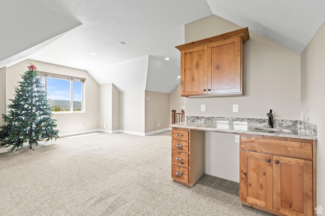84 W 2100 N, Kamas, UT 84036 - kitchen with light stone counters, light colored carpet, vaulted ceiling, and a sink