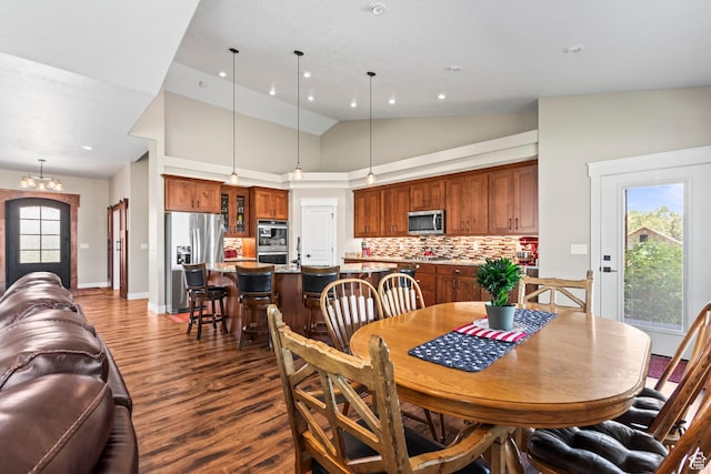 84 W 2100 N, Kamas, UT 84036 - dining space with baseboards, dark wood finished floors, high vaulted ceiling, a notable chandelier, and recessed lighting