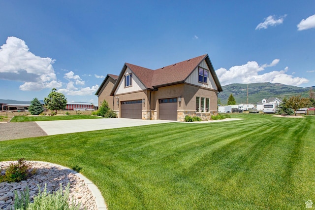 84 W 2100 N, Kamas, UT 84036 - view of front of house with a shingled roof, concrete driveway, stone siding, a mountain view, and a front lawn