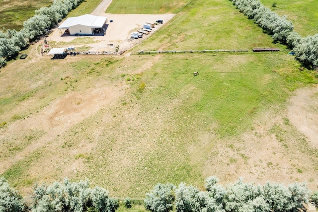 birds eye view of property with a rural view
