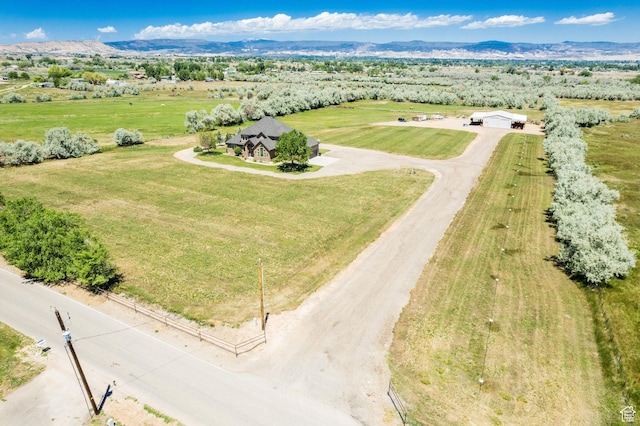 bird's eye view featuring a rural view and a mountain view