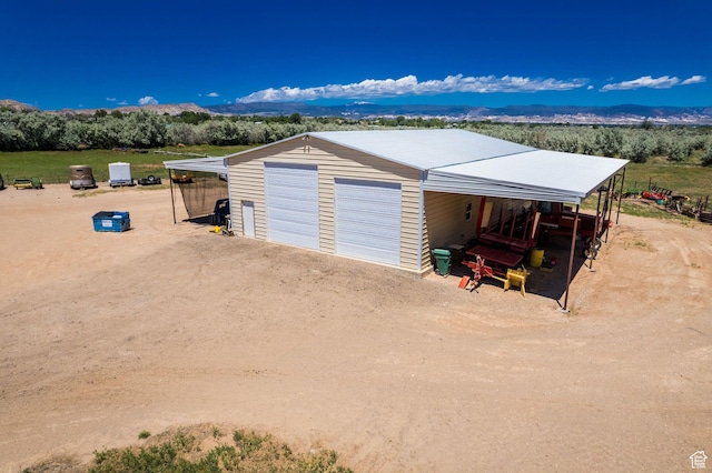 garage with a mountain view and a garage