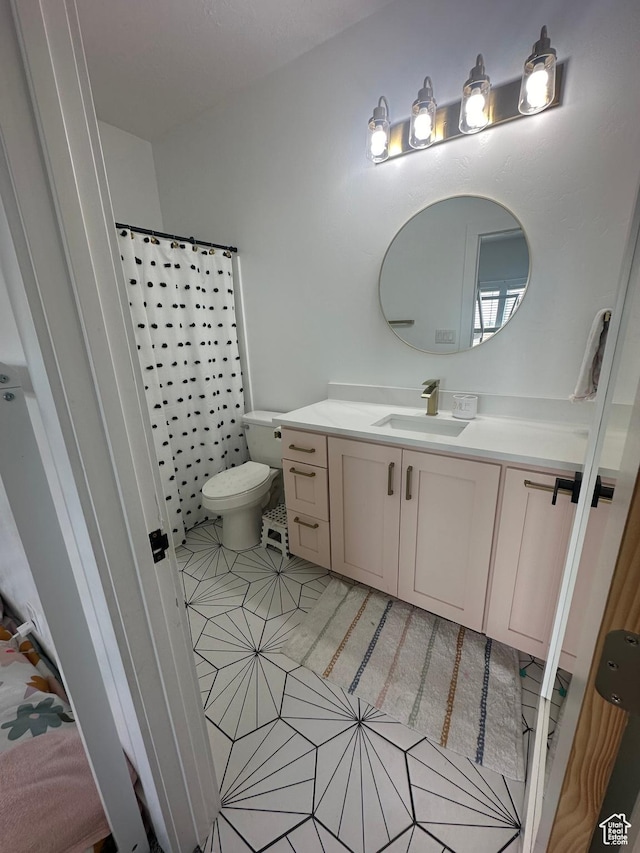 40 E 200 N, Castle Dale, UT 84513 - bathroom featuring tile patterned floors, vanity, toilet, and walk in shower