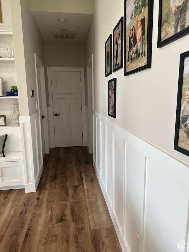 40 E 200 N, Castle Dale, UT 84513 - hallway featuring built in shelves and dark wood-type flooring