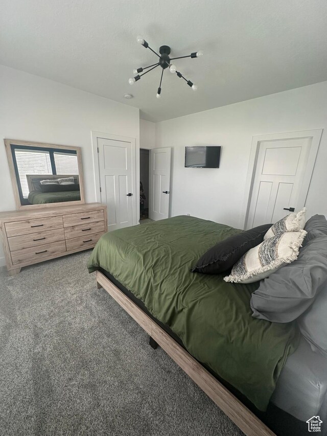 40 E 200 N, Castle Dale, UT 84513 - bedroom featuring carpet and ceiling fan with notable chandelier