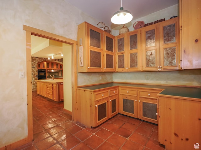 2718 E Stewart Rd, Sundance, UT 84604 - kitchen with oven, decorative light fixtures, sink, and dark tile floors
