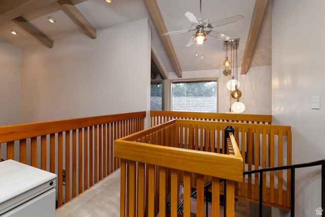 hallway featuring beam ceiling and an upstairs landing