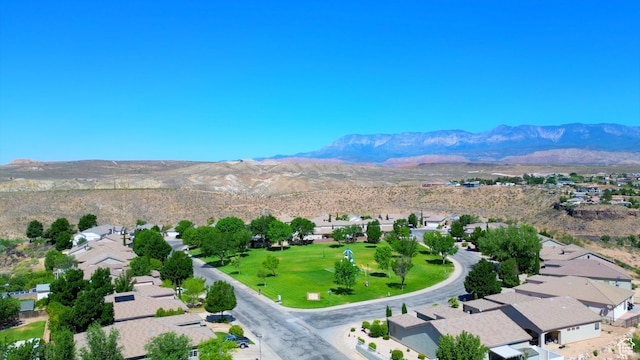 birds eye view of property with a mountain view