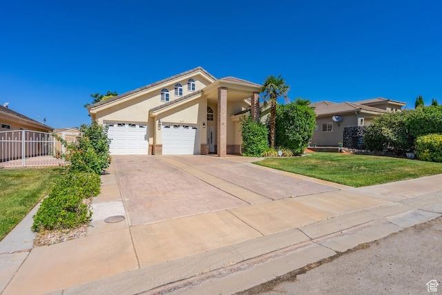 view of front of house with a front yard and a garage