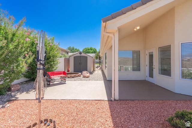 view of patio with a shed