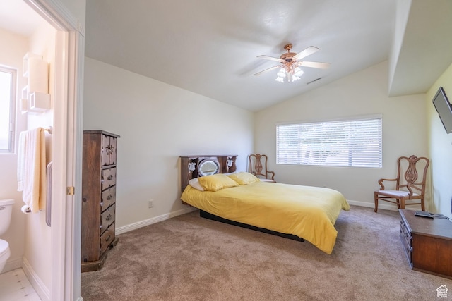 carpeted bedroom featuring ceiling fan and vaulted ceiling