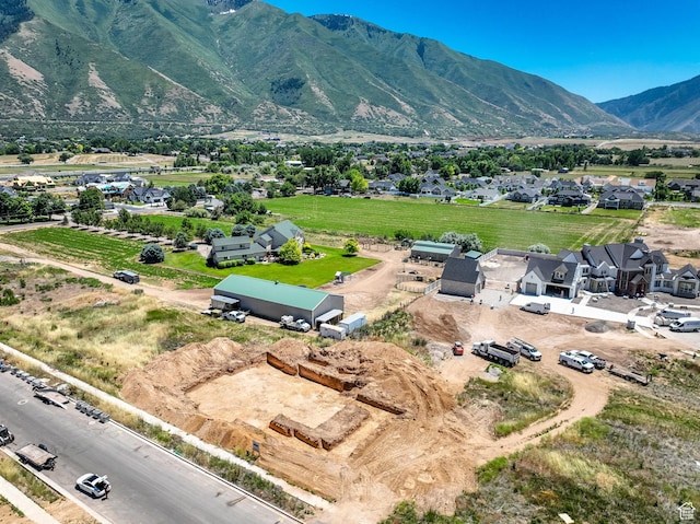birds eye view of property with a mountain view