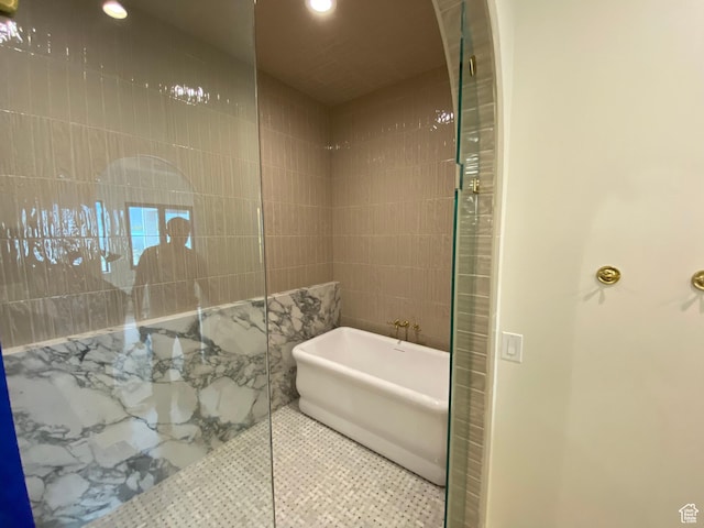 bathroom featuring a freestanding bath, tile patterned flooring, recessed lighting, and a walk in shower