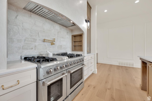 213 W 250 S Unit 15, Mapleton, UT 84664 - kitchen featuring double oven range, light countertops, light wood-style flooring, white cabinetry, and recessed lighting