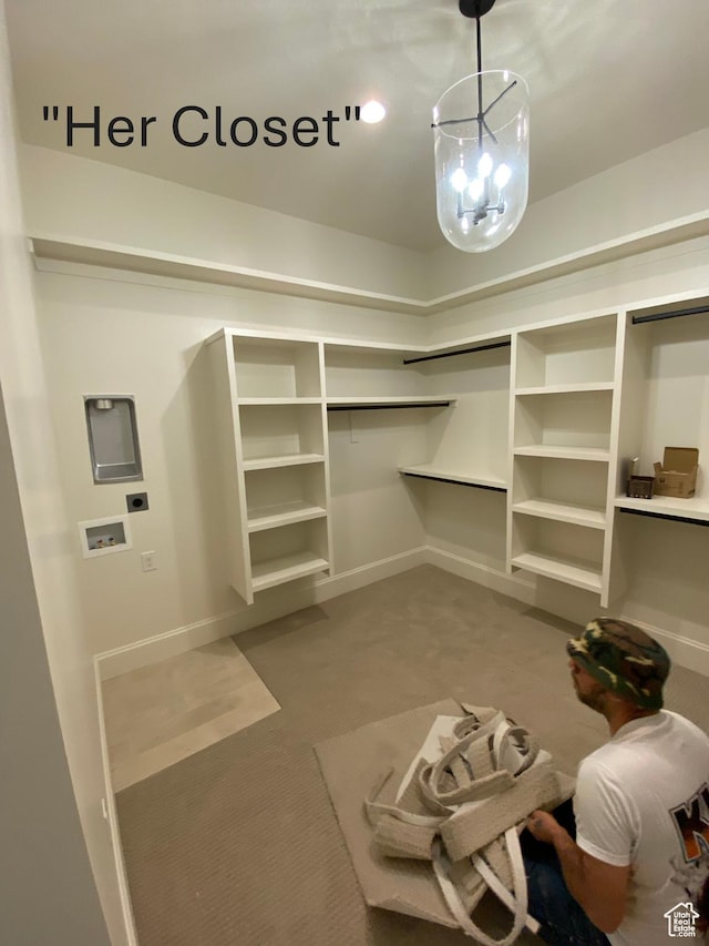 spacious closet with carpet floors