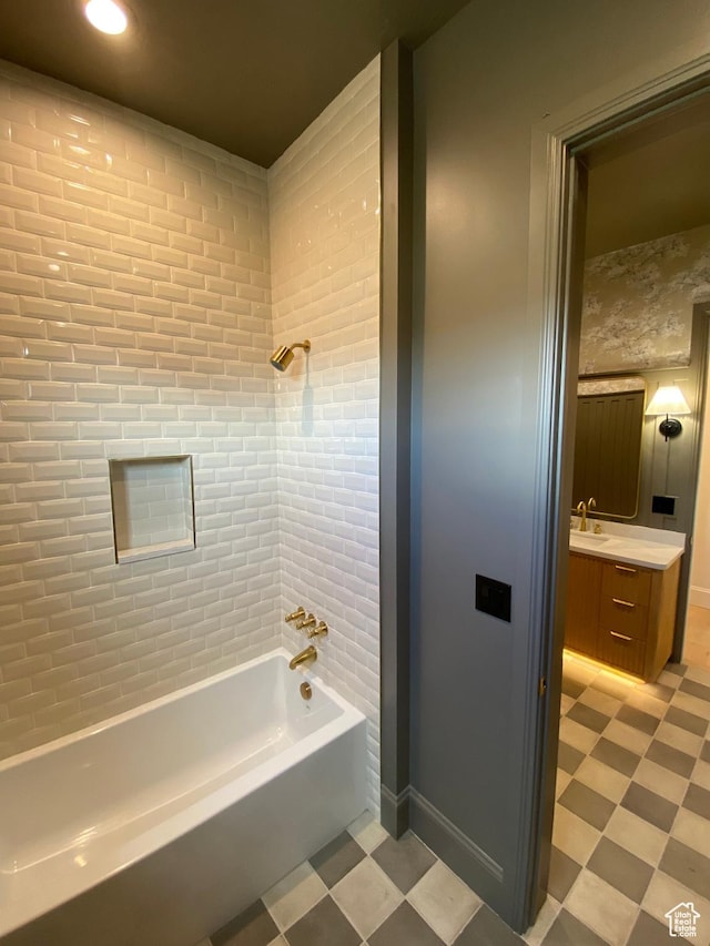 full bath featuring baseboards, bathtub / shower combination, vanity, and tile patterned floors