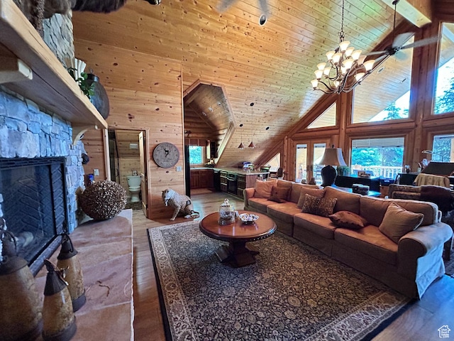 303 Rachel Ln S, New Harmony, UT 84757 - living room featuring hardwood / wood-style flooring, wooden ceiling, a fireplace, and wooden walls
