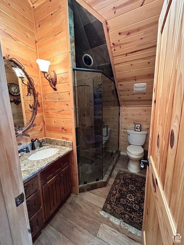 303 Rachel Ln S, New Harmony, UT 84757 - bathroom with hardwood / wood-style flooring, a shower with door, vanity, toilet, and wood walls