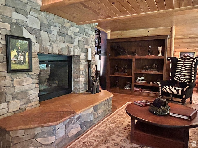 303 Rachel Ln S, New Harmony, UT 84757 - living room with beamed ceiling, a stone fireplace, and wood ceiling