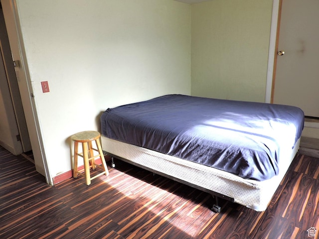 bedroom featuring dark wood-type flooring