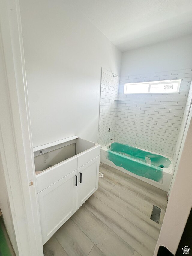 full bath featuring wood finished floors