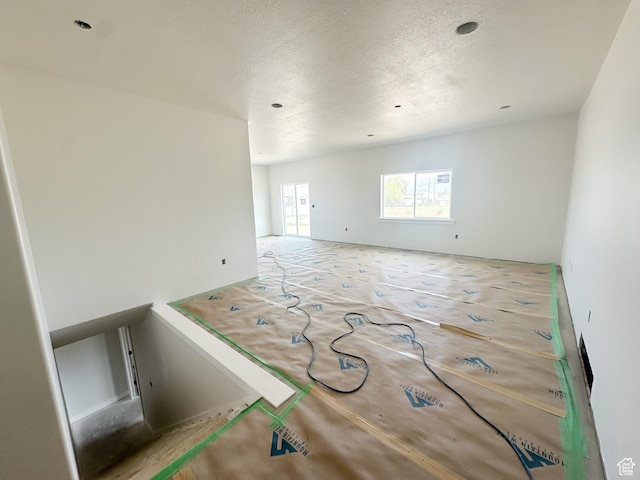 empty room with a textured ceiling
