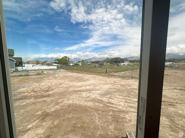 view of yard with a residential view and fence