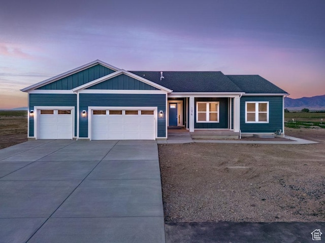 1076 N Windflower Ln W Unit 125, Grantsville, UT 84029 - view of front of home with a mountain view and a garage
