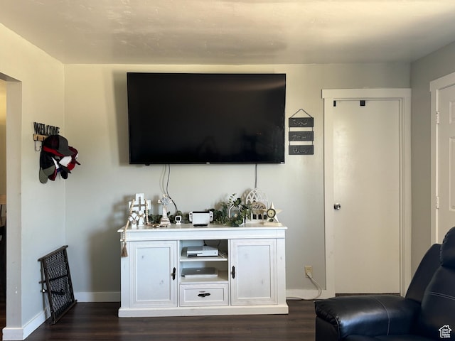339 Berkley Ave, East Carbon, UT 84520 - living room with baseboards and dark wood finished floors