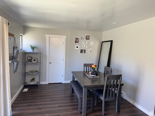 339 Berkley Ave, East Carbon, UT 84520 - dining space featuring baseboards and dark wood finished floors