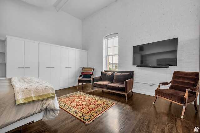 159 W Broadway Unit 301, Salt Lake City, UT 84101 - bedroom featuring beamed ceiling, high vaulted ceiling, a closet, and hardwood / wood-style floors