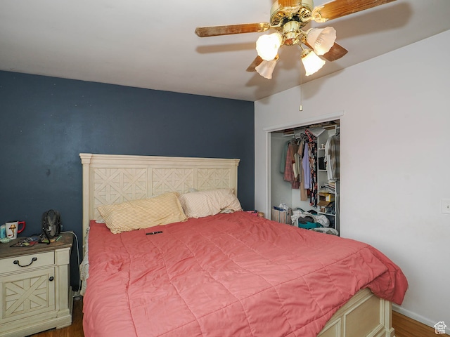 bedroom with ceiling fan, a closet, and hardwood / wood-style flooring