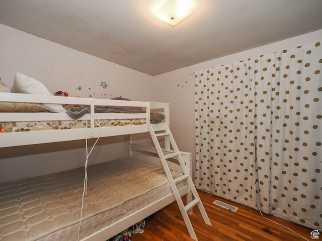bedroom featuring wood-type flooring
