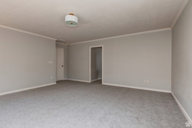 carpeted spare room with crown molding and a textured ceiling