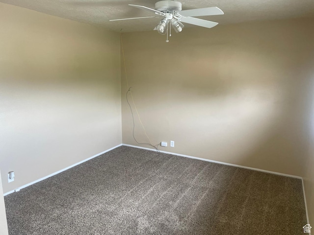 unfurnished room with baseboards, carpet, and a ceiling fan