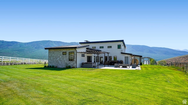 1245 E Draper Ln, Wallsburg, UT 84082 - back of house featuring a mountain view, an outdoor living space, a yard, and a hot tub