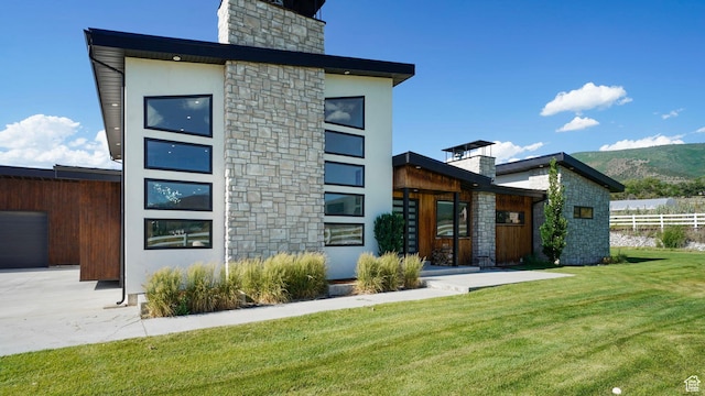 back of property featuring a yard