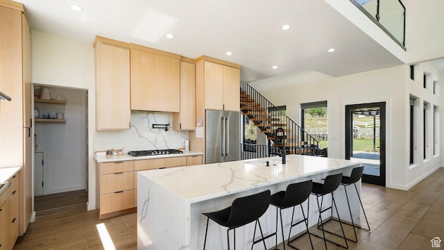 1245 E Draper Ln, Wallsburg, UT 84082 - kitchen featuring high end refrigerator, a center island with sink, and light brown cabinets