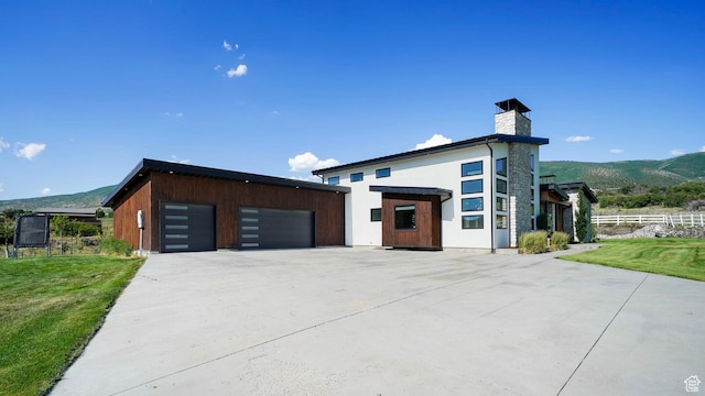 1245 E Draper Ln, Wallsburg, UT 84082 - view of front of property with a mountain view, a garage, and a front lawn