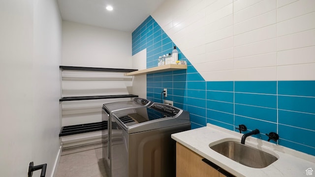 1245 E Draper Ln, Wallsburg, UT 84082 - clothes washing area with tile patterned floors, washer and dryer, sink, and tile walls