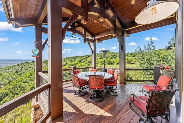 1355 W Red Hawk Trl Unit 35, Park City, UT 84098 - deck featuring outdoor dining area and a wooded view
