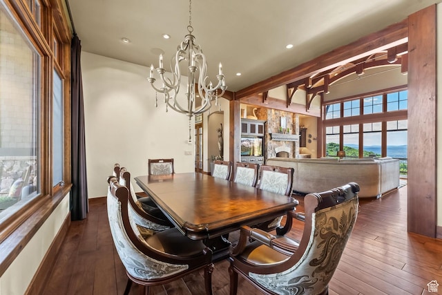 1355 W Red Hawk Trl Unit 35, Park City, UT 84098 - dining room with a stone fireplace, recessed lighting, dark wood-style floors, beamed ceiling, and an inviting chandelier