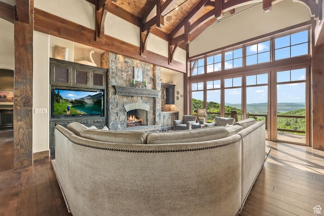1355 W Red Hawk Trl Unit 35, Park City, UT 84098 - living area with high vaulted ceiling, dark wood-type flooring, beamed ceiling, and a fireplace