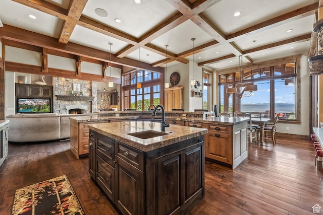 1355 W Red Hawk Trl Unit 35, Park City, UT 84098 - kitchen featuring an island with sink, coffered ceiling, dark wood-style flooring, and a sink