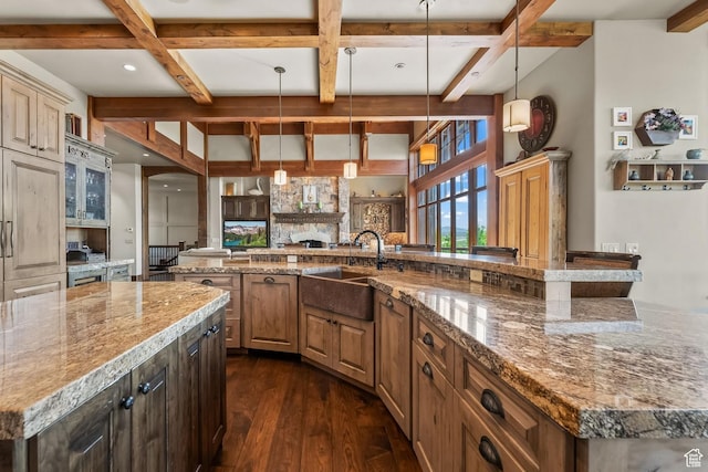 1355 W Red Hawk Trl Unit 35, Park City, UT 84098 - kitchen with dark wood-type flooring, a sink, a large island, light stone countertops, and beamed ceiling