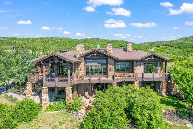 1355 W Red Hawk Trl Unit 35, Park City, UT 84098 - rear view of house with a chimney, a wooded view, and a wooden deck