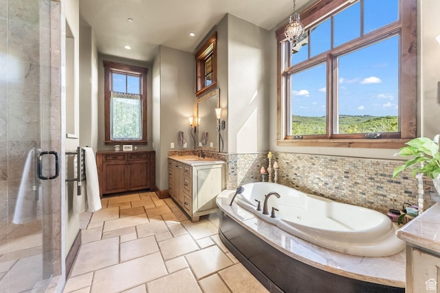 1355 W Red Hawk Trl Unit 35, Park City, UT 84098 - bathroom featuring a healthy amount of sunlight, a stall shower, a whirlpool tub, and vanity