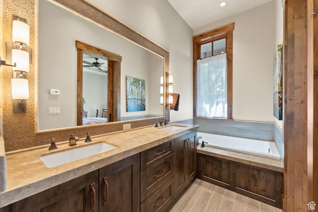 1355 W Red Hawk Trl Unit 35, Park City, UT 84098 - bathroom featuring wood finished floors, a sink, a bath, and connected bathroom