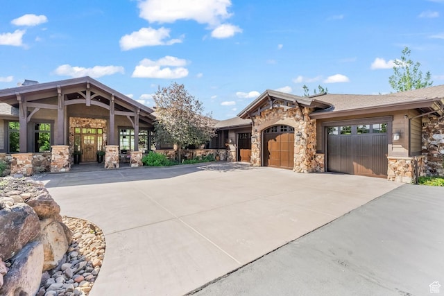 1355 W Red Hawk Trl Unit 35, Park City, UT 84098 - view of front of house with an attached garage, stone siding, and concrete driveway