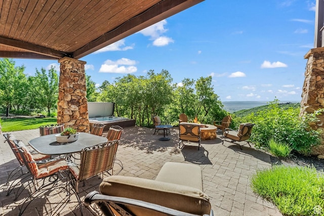 1355 W Red Hawk Trl Unit 35, Park City, UT 84098 - view of patio with a hot tub and a fire pit